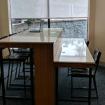 business center high top table with laptop